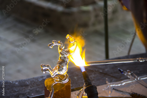 Glass rod melted and bended to be horse model