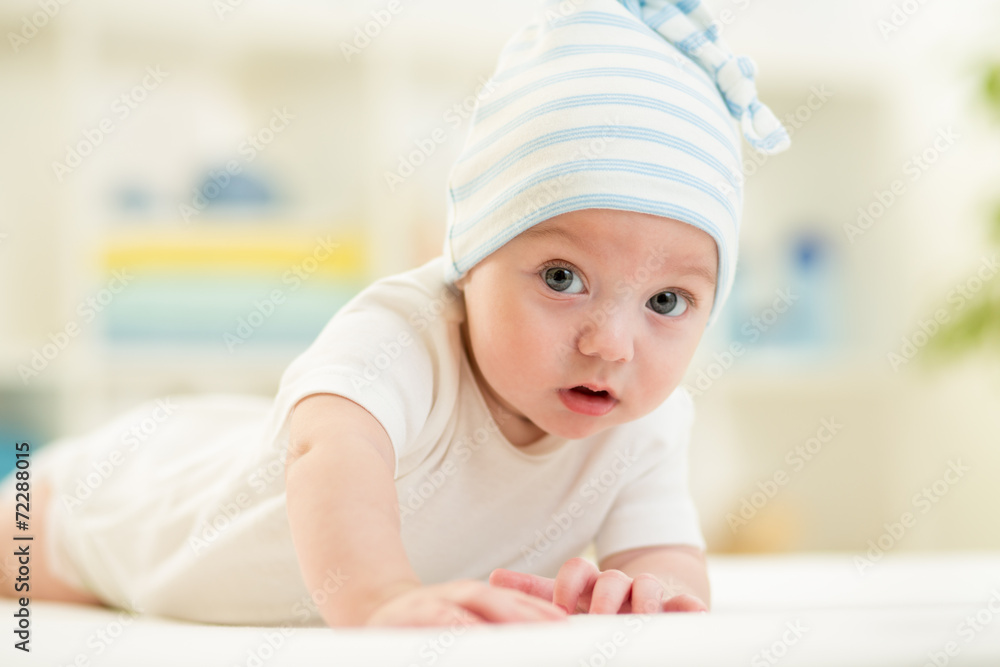 Smiling baby boy weared in cap Smiling baby boy weared in cap