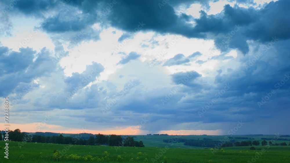 Moving rain clouds over field an sunset, time lapse full HD. Moving rain clouds over field an sunset, time lapse full HD.