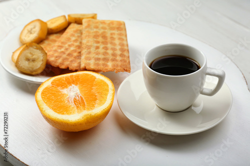 Delicious breakfast with coffee, cookies and fruits