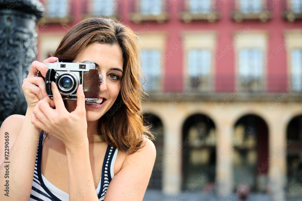 Female tourist taking photos in Spain