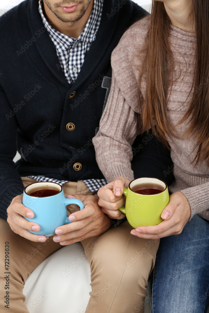Loving couple with hot drinks Loving couple with hot drinks