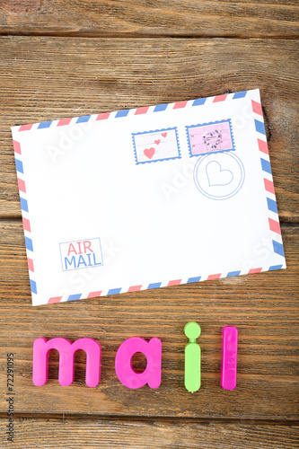 Mail word formed with colorful letters on wooden background © Africa Studio