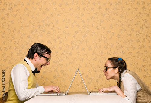 Foto Young nerds sitting at the desk