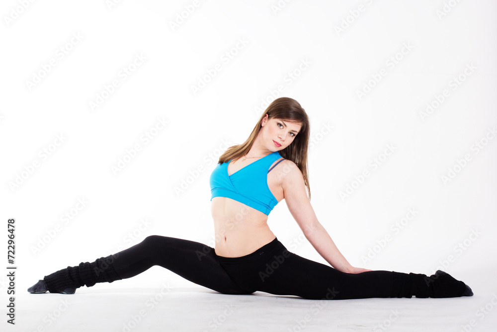 Young happy woman does fitness exercise Young happy woman does fitness exercise