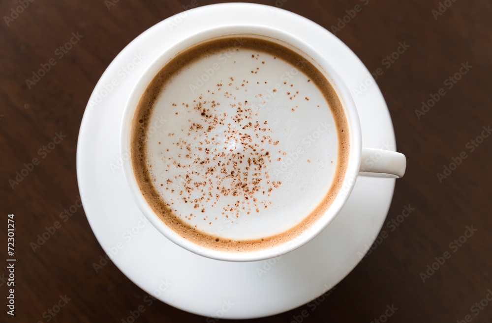 cup of fresh cappuccino on table cup of fresh cappuccino on table