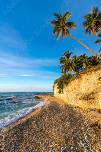 Beach cliff near Barahona with tropical sea and sandy front