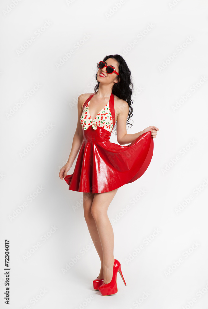 Sexy woman wearing red latex dress with sunglasses Sexy woman wearing red latex dress with sunglasses