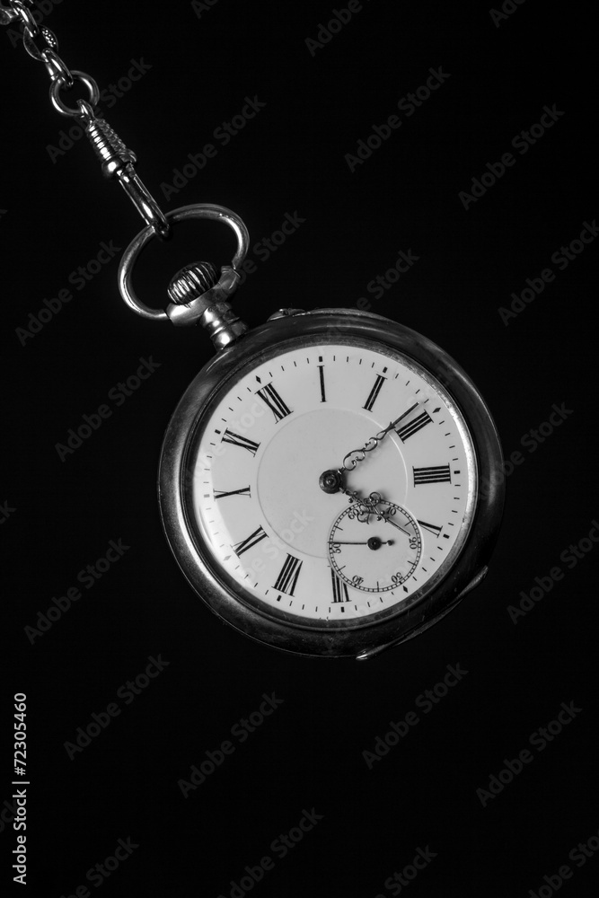 old pocket watch in black and white old pocket watch in black and white