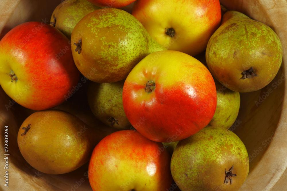 Apples and pears in a wooden bowl. Apples and pears in a wooden bowl.