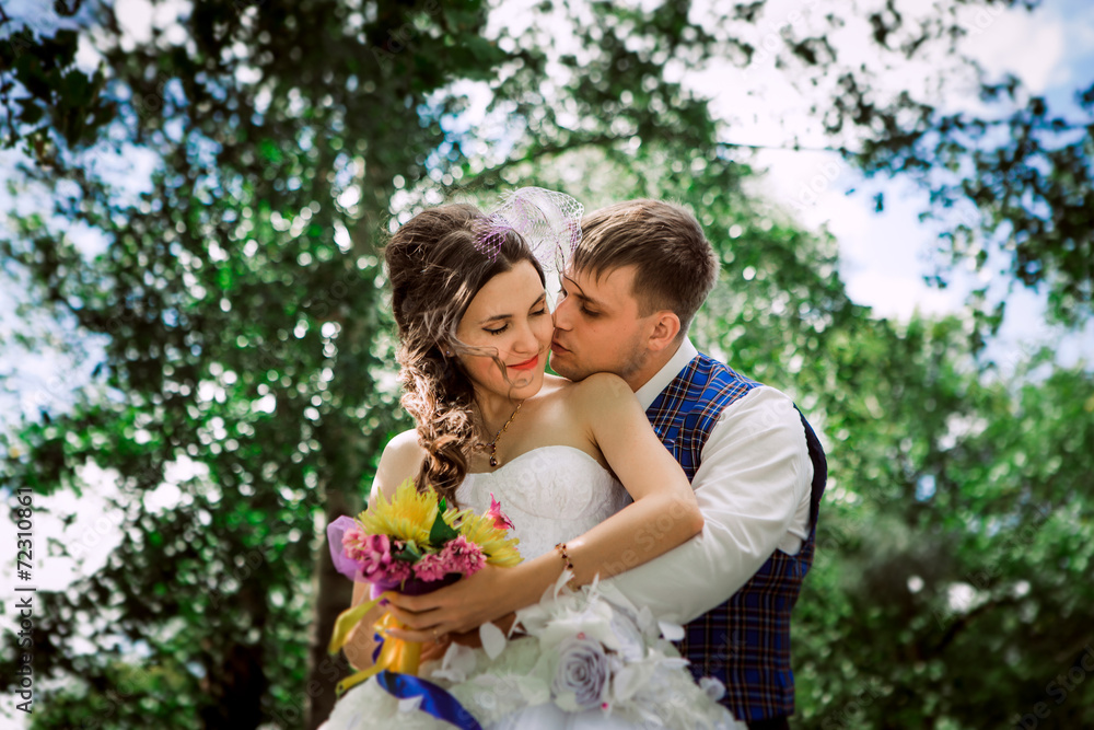 Married Couple in forest embracing Married Couple in forest embracing