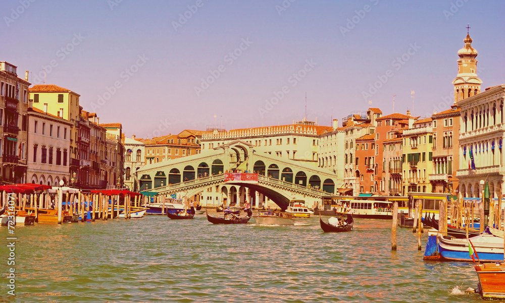 Wonderful view of gondolas and bridges in love on the Grand Cana