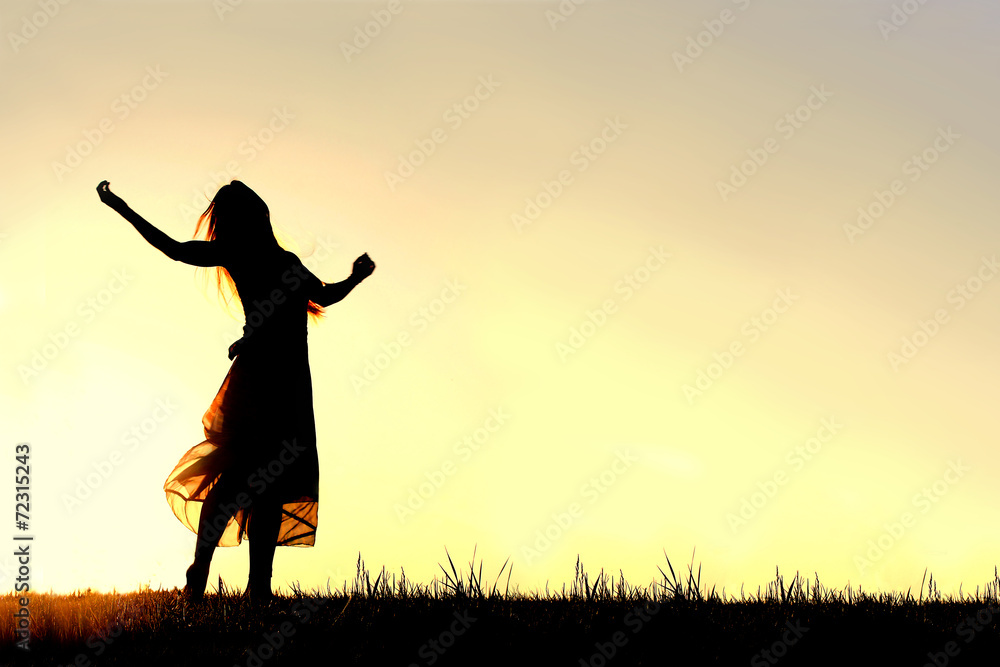 Silhouette of Woman Dancing and Praising God at Sunset Silhouette of Woman Dancing and Praising God at Sunset