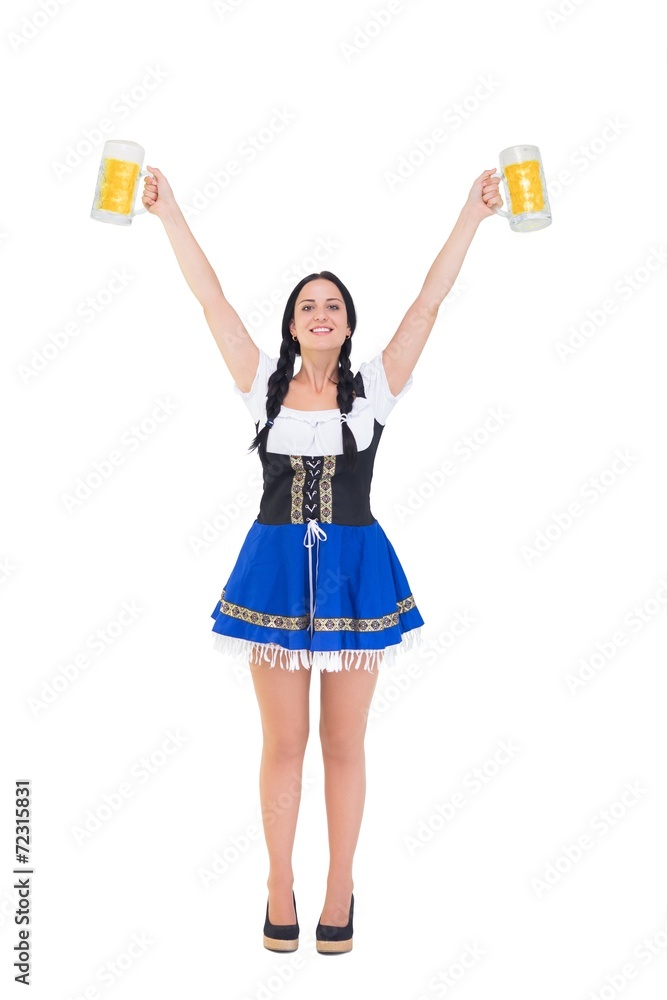 Pretty oktoberfest girl holding beer tankards Pretty oktoberfest girl holding beer tankards