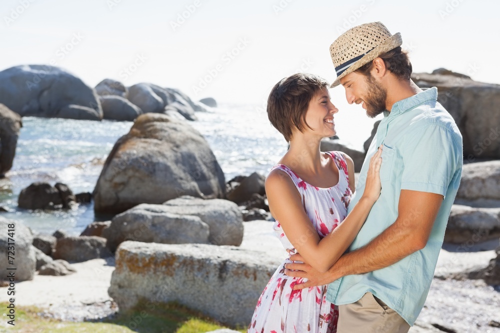 Gorgeous couple embracing by the coast Gorgeous couple embracing by the coast