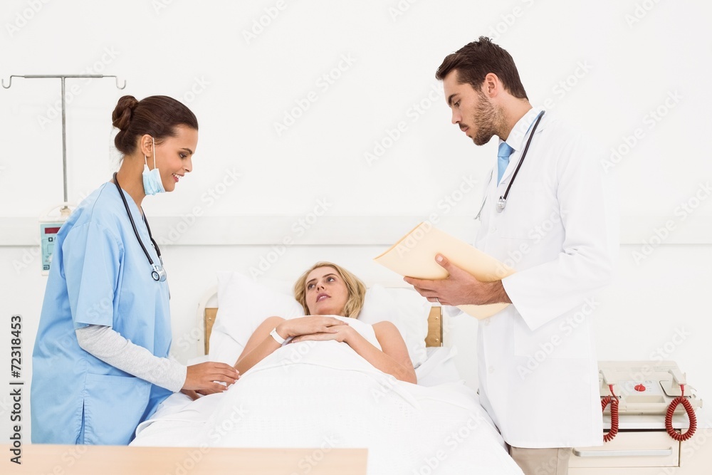 Doctors visiting patient in hospital Doctors visiting patient in hospital