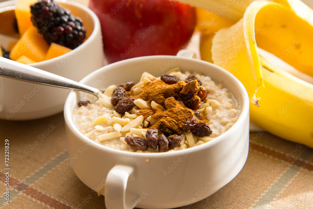 Fresh fruit and oatmeal with healthy toppings for breakfast Fresh fruit and oatmeal with healthy toppings for breakfast