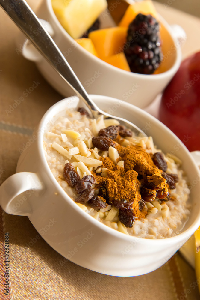 Fresh fruit and oatmeal with healthy toppings for breakfast Fresh fruit and oatmeal with healthy toppings for breakfast
