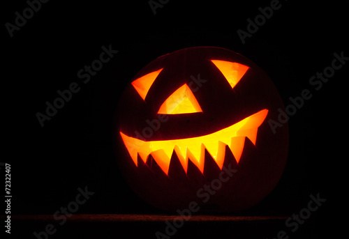 Scary carved pumpkin halloween concept