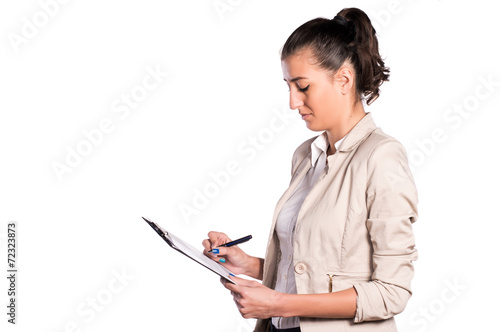 attractive woman writing on clip board white isolated