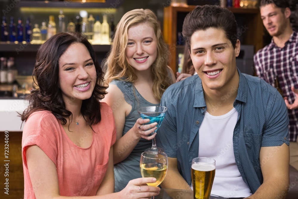 Young friends having a drink together Young friends having a drink together
