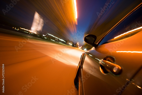 Car in motion at night