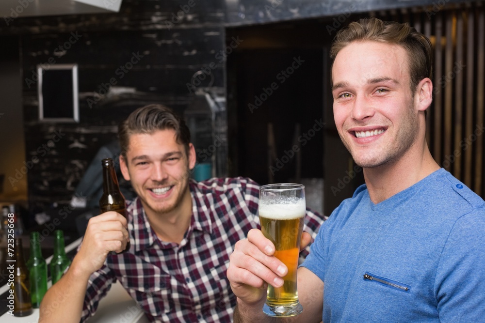 Young men drinking beer together