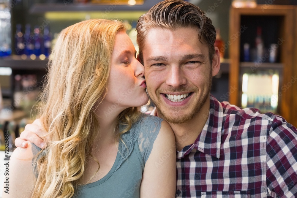 Young couple smiling at the camera Young couple smiling at the camera