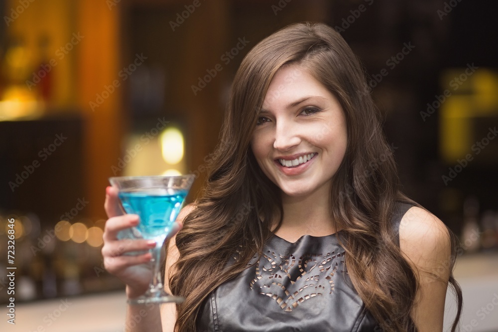 Pretty brunette holding a cocktail Pretty brunette holding a cocktail