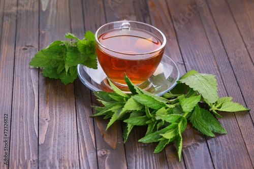 Cup of fresh herbal tea photo