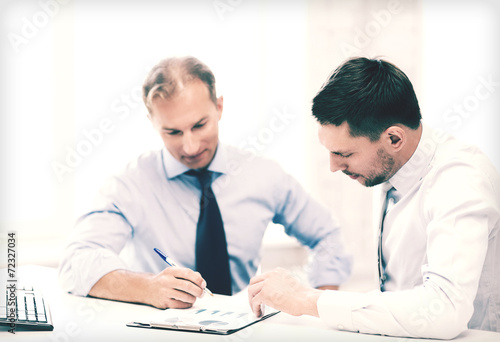 businessmen with notebook on meeting