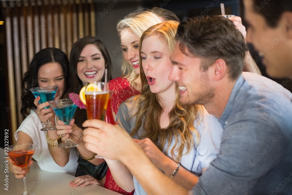 Young friends having a drink together Young friends having a drink together
