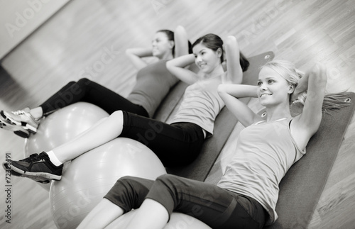 group of people working out in pilates class