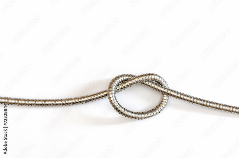 a single knot in a flexible metal hose