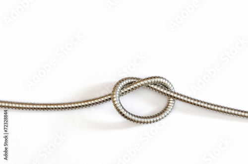 a single knot in a flexible metal hose