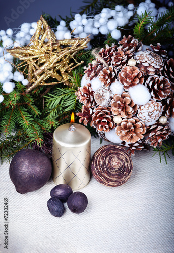 Still life with candle and christmas decorations