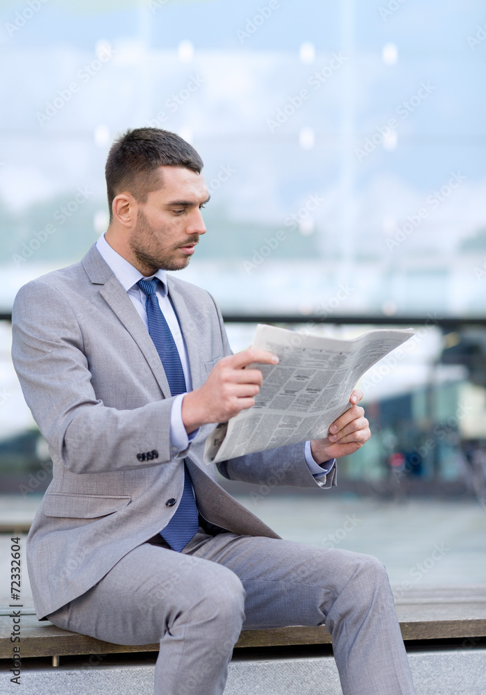 young serious businessman newspaper outdoors young serious businessman newspaper outdoors
