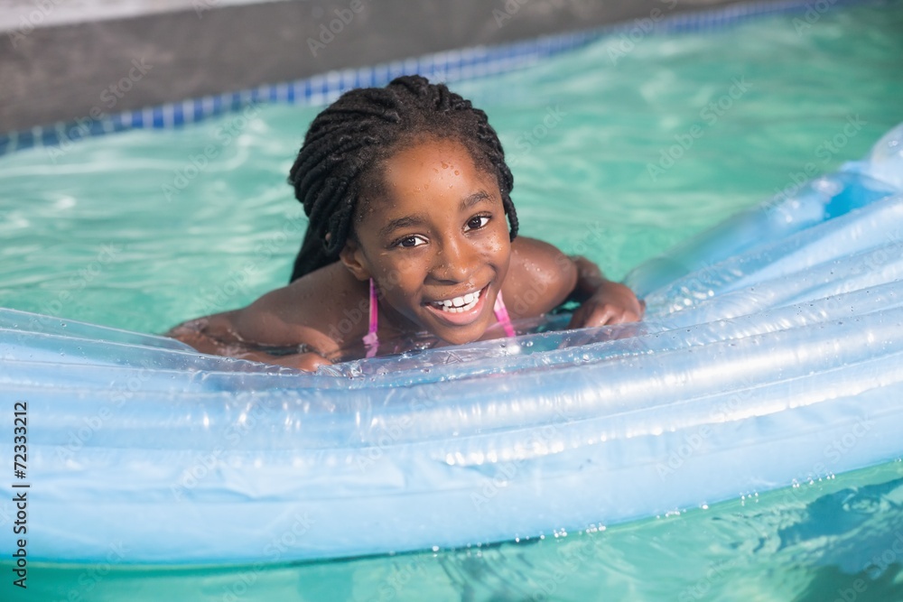 Cute little girl swimming in the pool Stock Photo | Adobe Stock