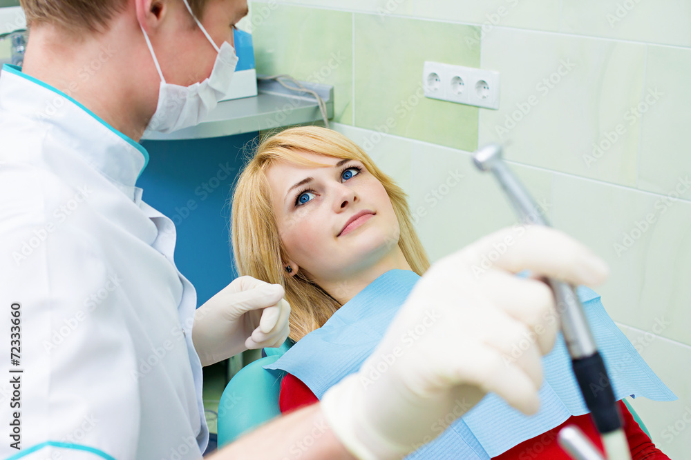 Fototapeta premium Happy smiling female patient dentist office ready for procedure