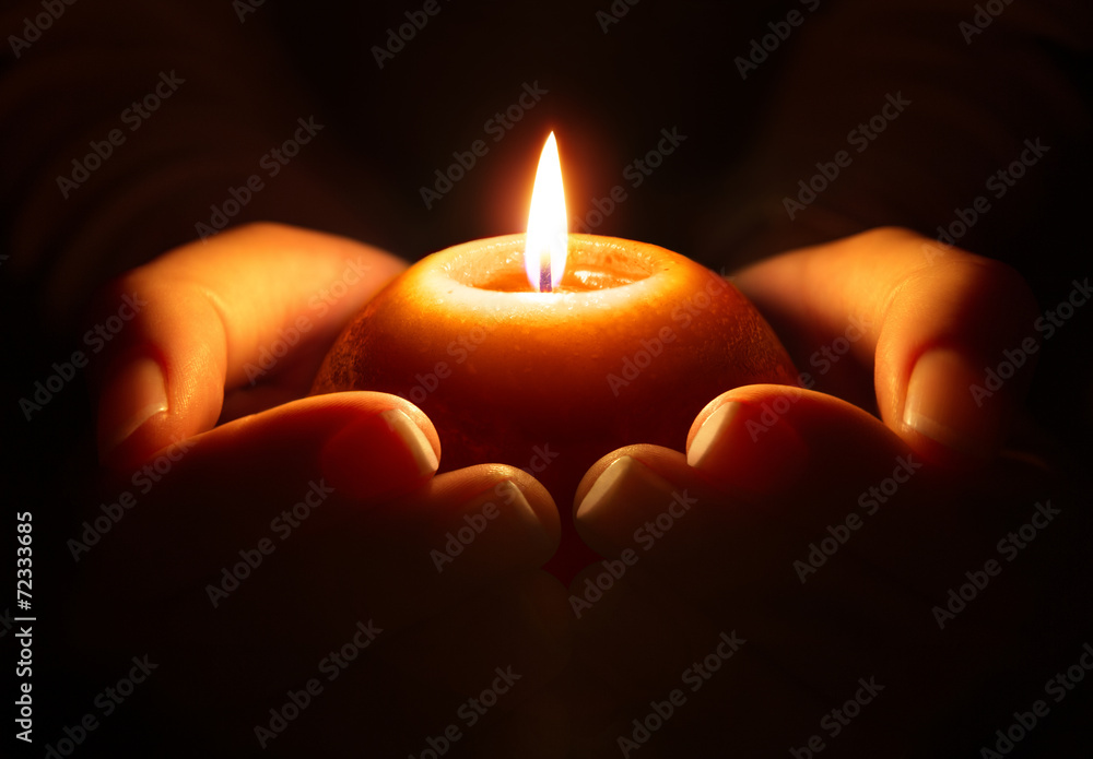 prayer - candle in hands - obrazy, fototapety, plakaty 