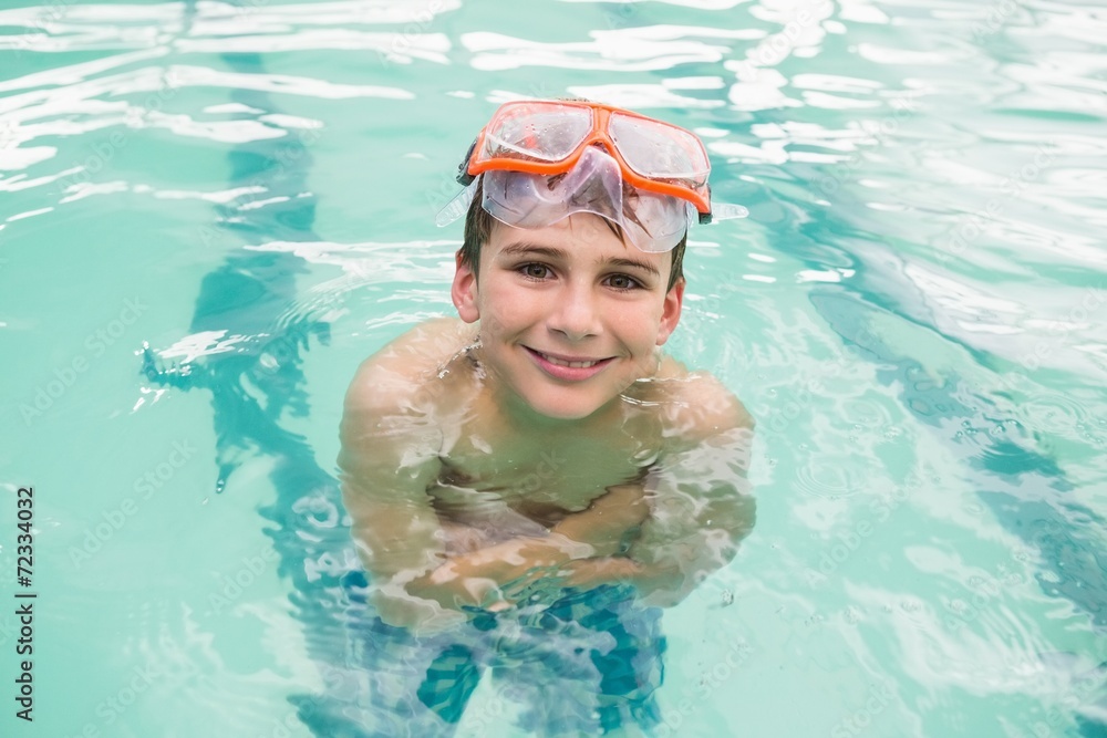 Cute little boy in the swimming pool