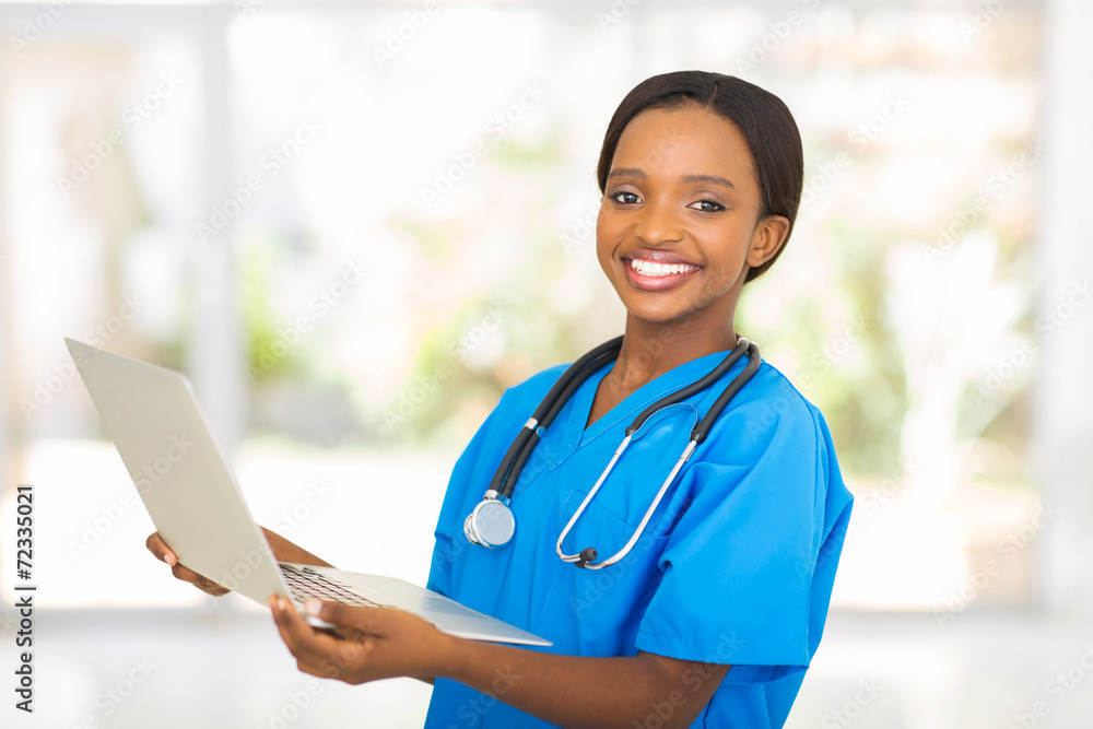 african medical worker holding laptop computer african medical worker holding laptop computer