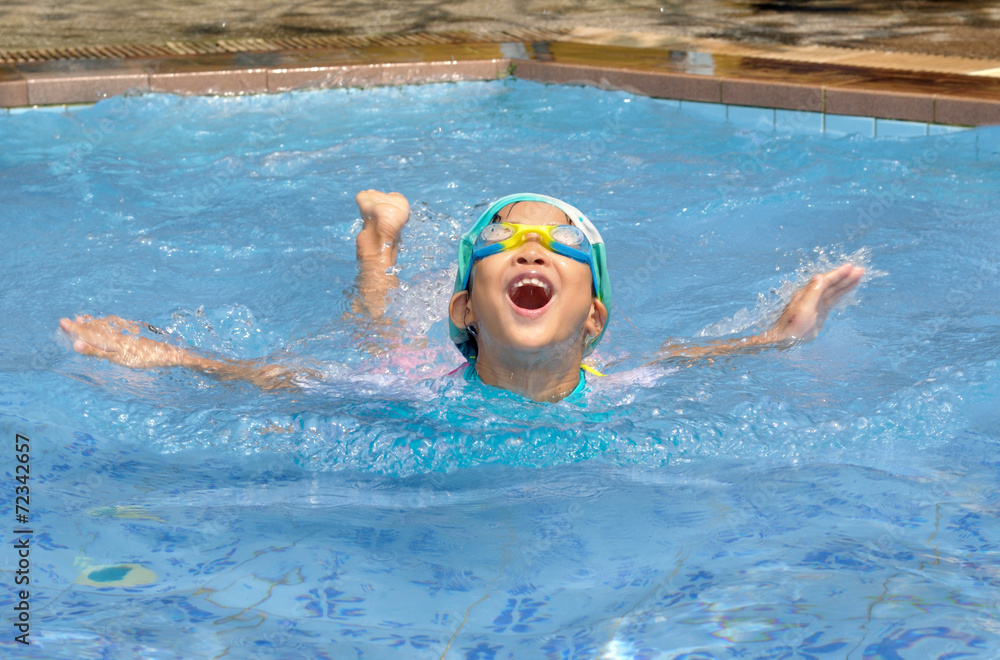 Asian child practice swimming