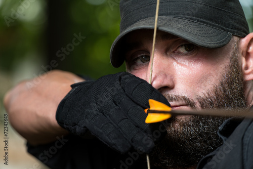 Caucasian Man Training With The Bow