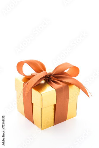 Gold gift box isolated on white background © siraphol