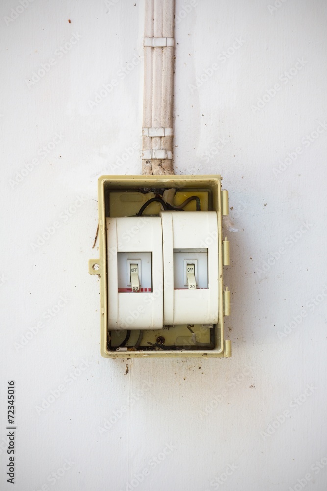 old light switch in the Off Position on dirty and old wall old light switch in the Off Position on dirty and old wall