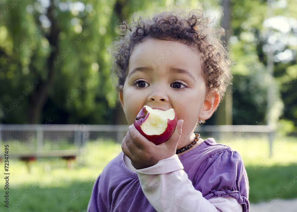 Child eating apple Child eating apple