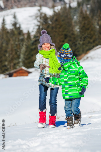 Happy kids playing winter