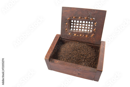 Dried, processed and blended tea leaves in wooden box