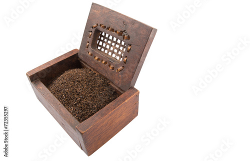 Dried, processed and blended tea leaves in wooden box